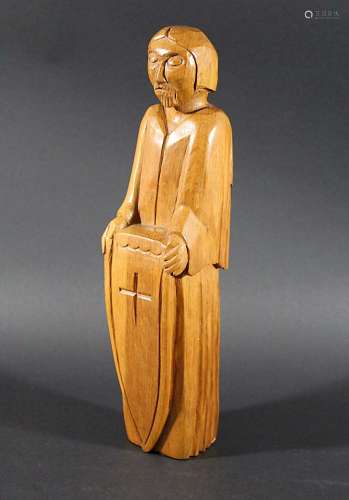 CARVED OAK RELIGIOUS FIGURE in the style of Robert Thompson (Mouseman), a carved oak religious