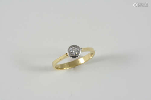 A DIAMOND SOLITAIRE RING the circular-cut diamond is set in 18ct. gold. Size P.