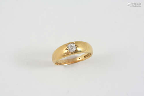 A DIAMOND SOLITAIRE RING the 18ct. gold band is set with an old brilliant-cut diamond. Size R.