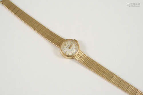 A LADY'S 9CT. GOLD WRISTWATCH BY ROLEX the signed circular dial with baton numerals, on an