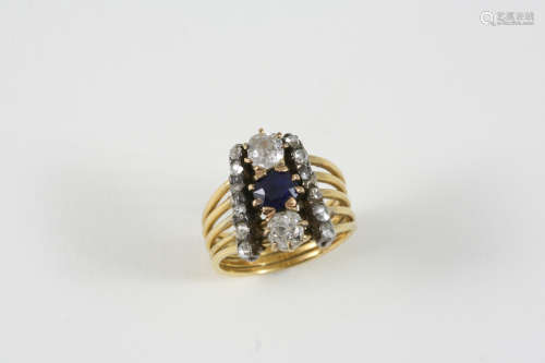 A LATE VICTORIAN SAPPHIRE AND DIAMOND RING the central sapphire is set with two old brilliant-cut