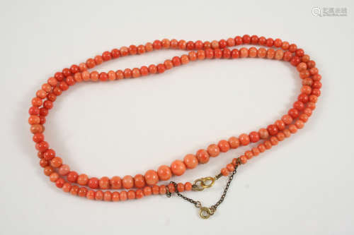 A SINGLE ROW GRADUATED CORAL BEAD NECKLACE the coral beads graduate from approximately 4.3 to 8.