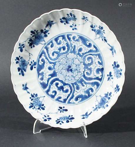 CHINESE SAUCER DISH, Kangxi, blue painted with a peony pattern inside a scalloped rim, blue five