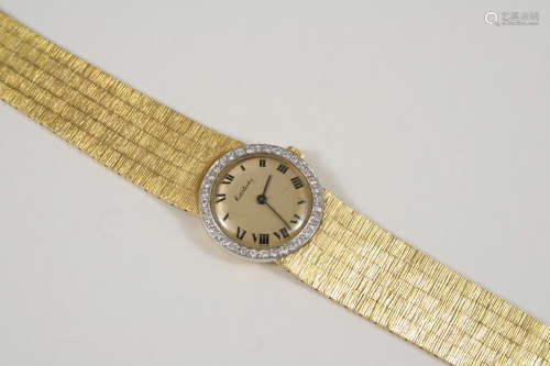 A DIAMOND AND 18CT. GOLD WRISTWATCH BY KUTCHINSKY the signed circular dial with Roman numerals, with