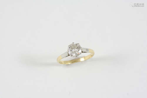 A DIAMOND SOLITAIRE RING the round brilliant-cut diamond is set in 18ct. gold. Size M.