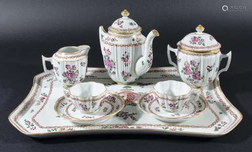 SAMSON STYLE TRAYED ARMORIAL BREAKFAST SET, 19th century, of moulded reeded form, painted in the