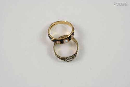 A GEORGE III DIAMOND AND PEARL MOURNING RING the 18ct. gold and black enamel band is mounted with