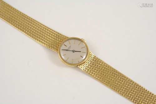A LADY'S 18CT. GOLD WRISTWATCH WATCH the circular dial signed Universal Geneve and with baton