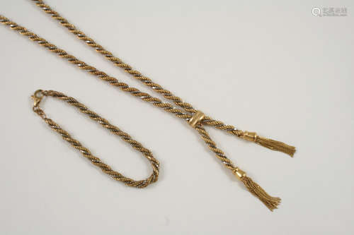 A 9CT. GOLD TWISTED ROPE LINK TASSEL NECKLACE 48cm. long, together with a matching bracelet, 17cm.