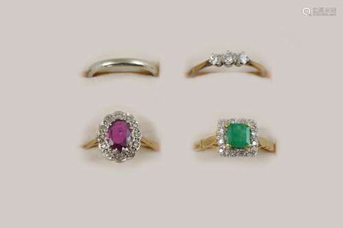 FOUR ASSORTED GOLD AND GEM SET RINGS including a diamond three stone ring, set in 18ct. gold and