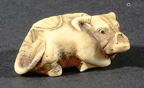 JAPANESE BONE NETSUKE OF A WATER BUFFALO, recumbent, length 4.5cm