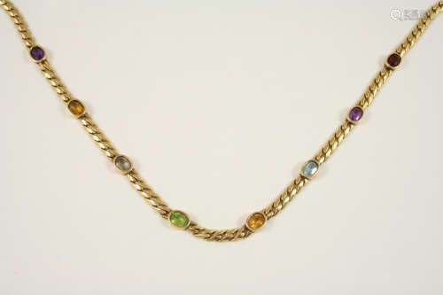 A GOLD AND GEM SET NECKLACE the 18ct. gold flat curb necklace is mounted with assorted oval-shaped