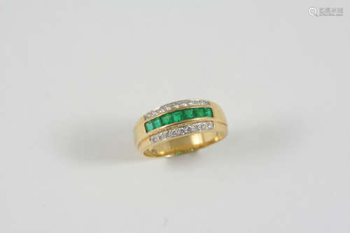 AN EMERALD AND DIAMOND HALF HOOP RING the 18ct. gold band is set with a row of square-cut emeralds