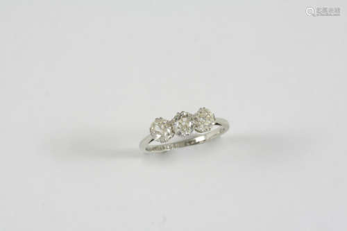 A DIAMOND THREE STONE RING the three old brilliant-cut diamonds are set in 18ct. gold and