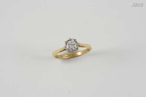 A DIAMOND SOLITAIRE RING set with a circular-cut diamond in 18ct. gold. Size N.