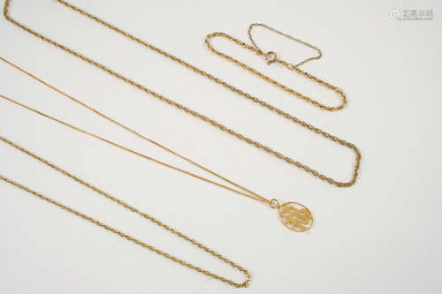 A 14CT. GOLD PENDANT depicting a Chinese character, on a 14ct. gold chain, 3 grams, together with