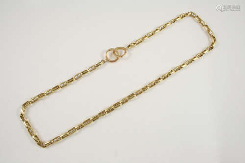 A 14CT. GOLD NECKLACE formed with oval openwork links, 59cm. long, 69.8 grams.