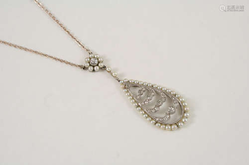 AN EARLY 20TH CENTURY DIAMOND AND PEARL PENDANT the openwork design is mounted with rose-cut and