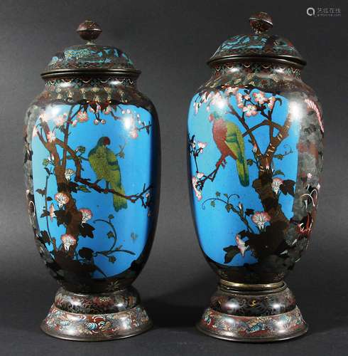 PAIR OF CLOISONNE VASES AND COVERS, worked in silver wire, with panels of cranes and parrots on a