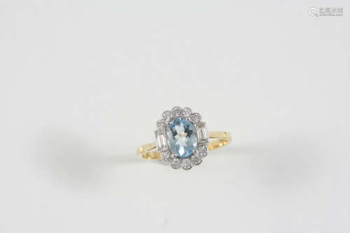 AN AQUAMARINE AND DIAMOND CLUSTER RING the oval-shaped aquamarine is set within a surround of two