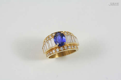 A SAPPHIRE AND DIAMOND RING the oval-shaped sapphire is set with graduated baguette-cut diamonds