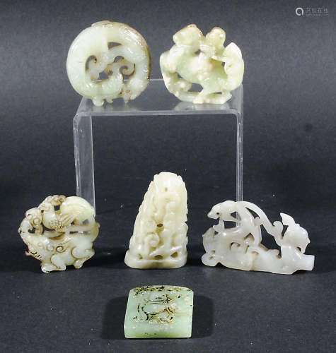 COLLECTION OF CHINESE JADE AND JADE TYPE CARVINGS, from white to mid celadon green, carved with