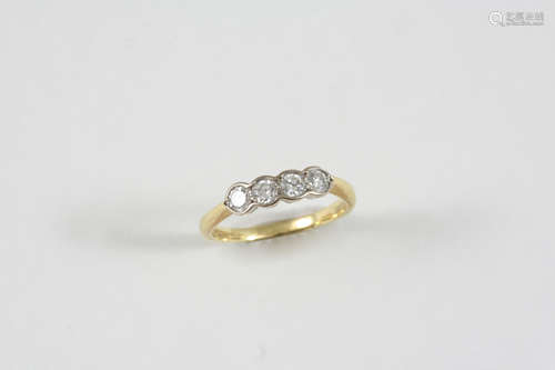 A DIAMOND FOUR STONE RING set with four circular-cut diamonds in 18ct. gold. Size P.