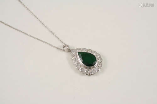 AN EMERALD AND DIAMOND CLUSTER PENDANT the pear-shaped emerald is set within a surround of