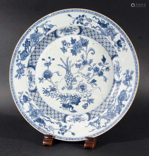 CHINESE BLUE AND WHITE CHARGER, painted with vases and flowers inside a trellis rim and floral