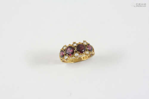 A VICTORIAN GARNET AND PEARL SET RING the four circular garnets are set with small half pearls, in
