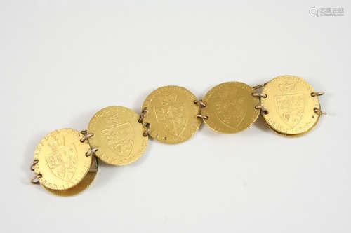 A BRACELET FORMED WITH DRILLED GEORGE III GUINEAS 62 grams.