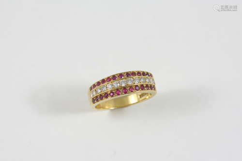 A RUBY AND DIAMOND THREE ROW RING the 18ct. gold ring is centred with a row of circular-cut