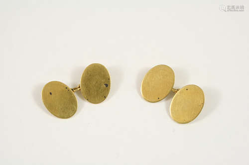 A PAIR OF 18CT. GOLD CUFFLINKS of oval, plain form, 12 grams.