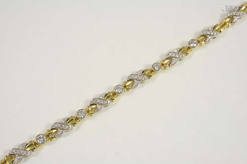 A DIAMOND AND GOLD BRACELET the 18ct. gold bracelet is mounted with circular-cut diamonds in