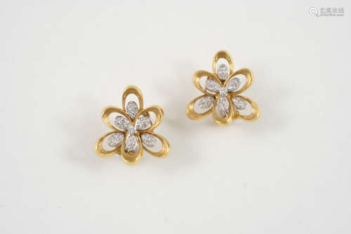 A PAIR OF DIAMOND AND GOLD EAR CLIPS the 18ct. gold openwork mounts are set with clusters of