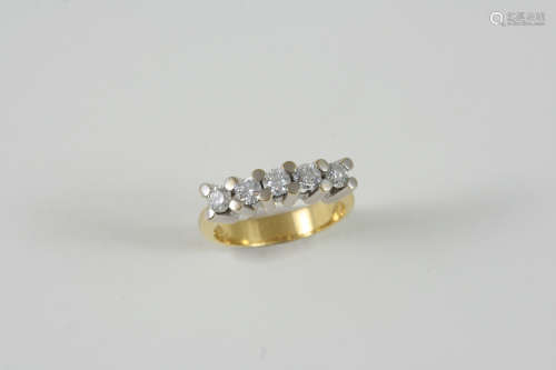 A DIAMOND FIVE STONE RING set with five circular brilliant-cut diamonds, in 18ct. gold. Size L.