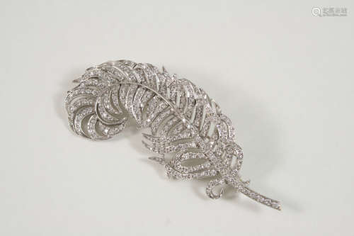 A DIAMOND SET FEATHER BROOCH set overall with circular-cut diamonds, in 18ct. white gold, 7cm.