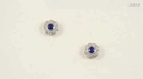 A PAIR OF SAPPHIRE AND DIAMOND CLUSTER STUD EARRINGS each earring set with a circular-cut sapphire