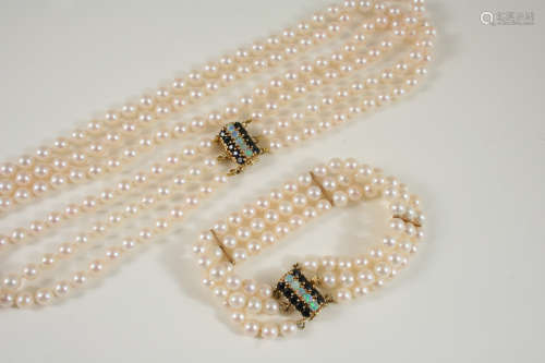 A THREE ROW UNIFORM CULTURED PEARL CHOKER the pearls measure approximately 5.6mm. and are set to