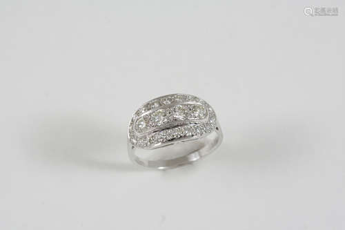 A DIAMOND CLUSTER RING centred with four circular-cut diamonds within a surround of smaller