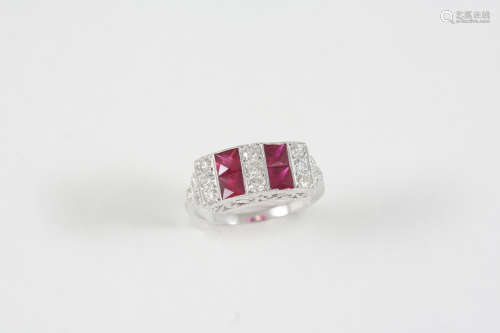 A RUBY AND DIAMOND RING the four calibre-cut rubies are set with circular-cut diamonds, in 18ct.