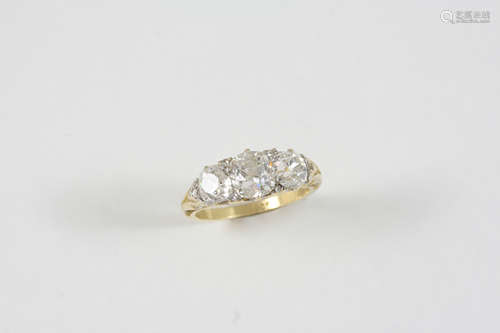 A DIAMOND THREE STONE RING the three old cushion-cut diamonds weigh approximately 2.39 carats in