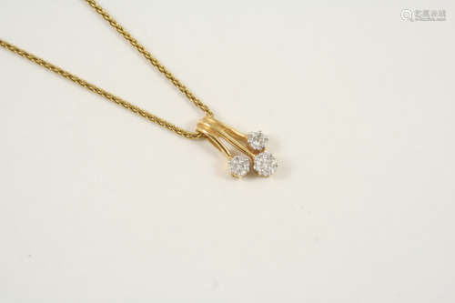A DIAMOND AND GOLD PENDANT the 18ct. gold pendant is formed as three diamond clusters, each set with