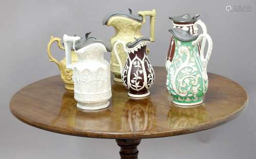COLLECTION OF VICTORIAN RELIEF MOULDED STONEWARE AND PARIAN JUGS, mainly buff and brown, to
