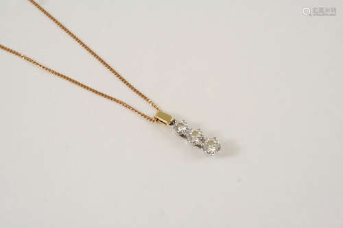 A DIAMOND THREE STONE PENDANT the three slightly graduated circular-cut diamonds are set in 18ct.