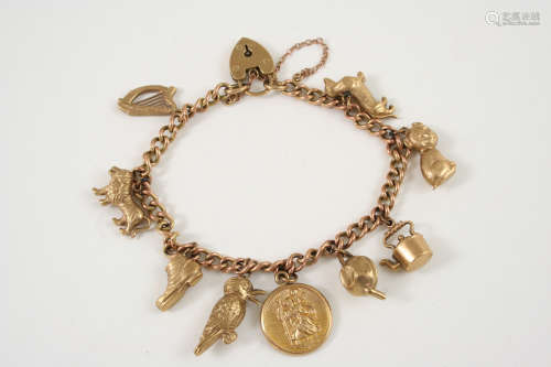 A 9CT. GOLD CURB LINK BRACELET mounted with assorted gold charms and with padlock clasp, 20.7