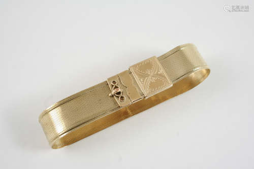 A 14CT. GOLD SLIDE BRACELET the woven link gold bracelet is set to a foliate engraved adjustable