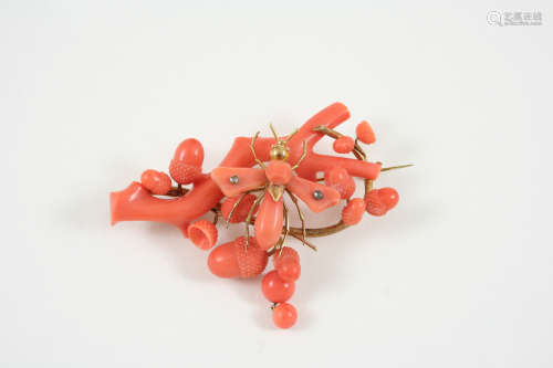A LARGE CORAL BROOCH designed as an oak branch mounted with acorns and an insect, in gold, 7.5cm.