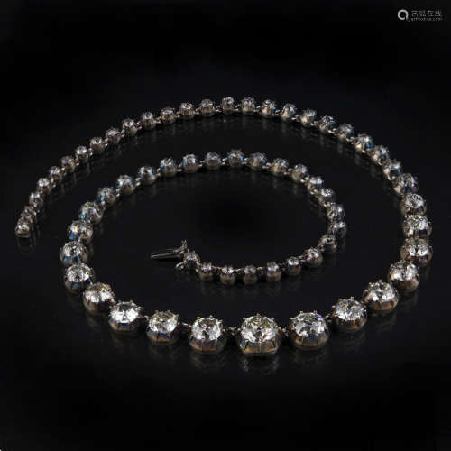 A VICTORIAN DIAMOND RIVIERE NECKLACE set with sixty one old brilliant-cut diamonds in cut down