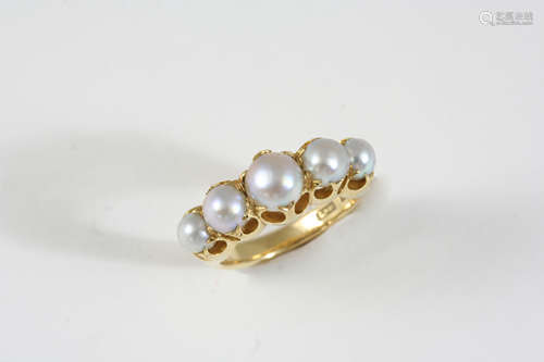 AN EARLY 20TH CENTURY NATURAL PEARL FIVE STONE RING the five graduated natural pearls are set in